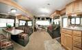 Living Area with Aspen Green Decor and Oak Cabinetry